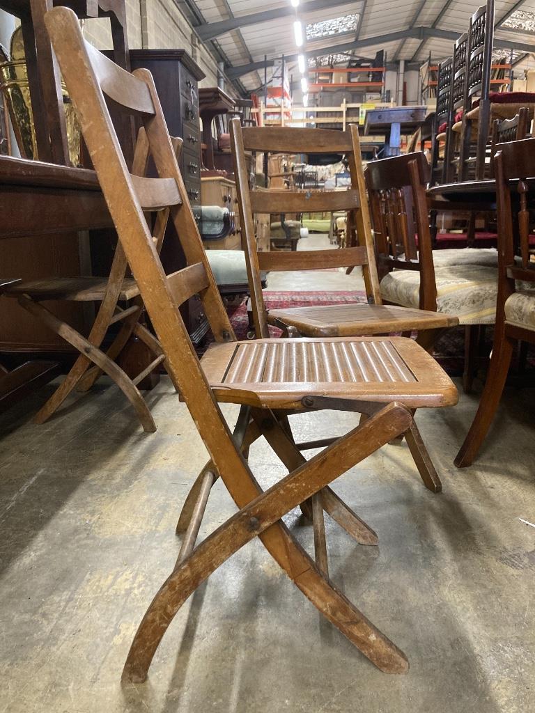 A set of eight early 20th century beech folding garden chairs